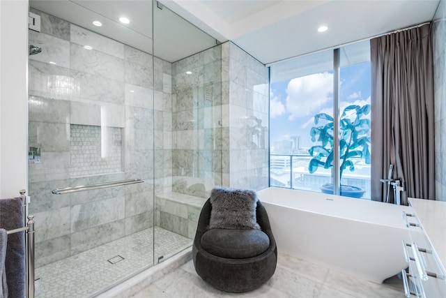 bathroom featuring plus walk in shower and vanity