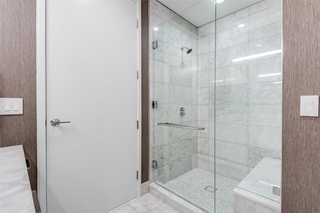 bathroom featuring an enclosed shower