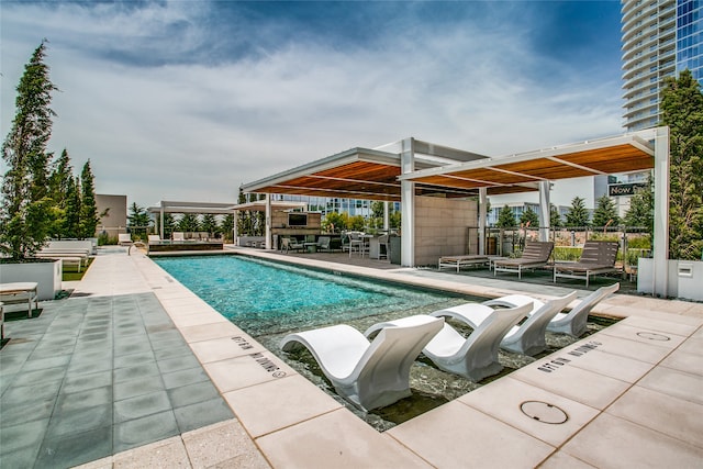 view of swimming pool featuring a patio area