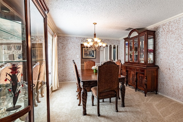 carpeted dining area with ornamental molding, a notable chandelier, and a textured ceiling