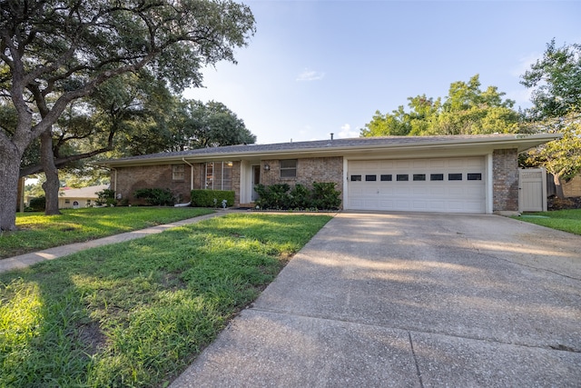 ranch-style house with a front lawn and a garage