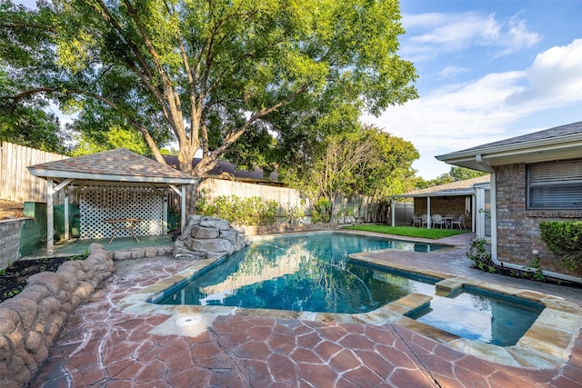 view of swimming pool with a gazebo and a patio area