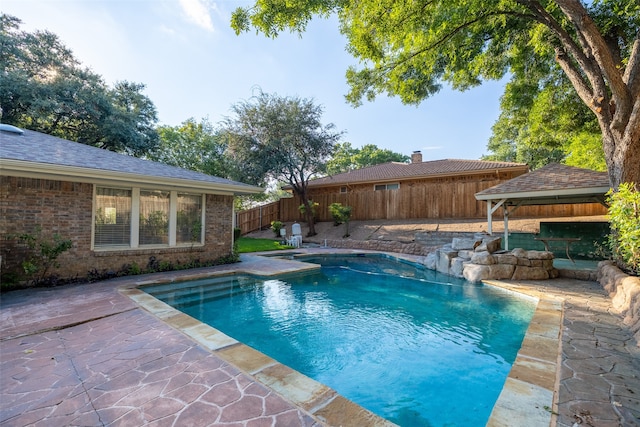 view of swimming pool with a patio area