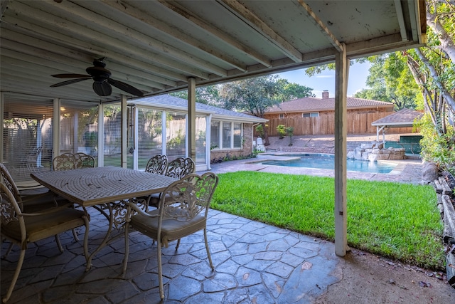 view of patio / terrace featuring ceiling fan and a fenced in pool