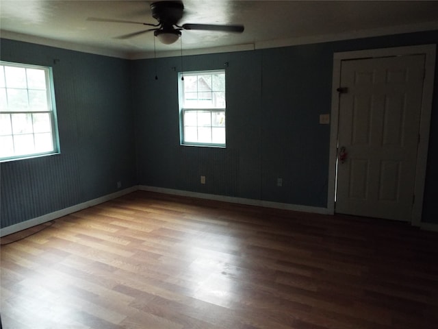 unfurnished room with ceiling fan and wood-type flooring