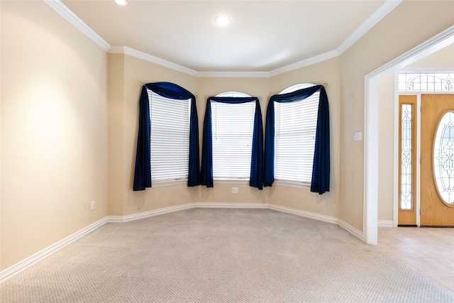 carpeted entrance foyer with crown molding