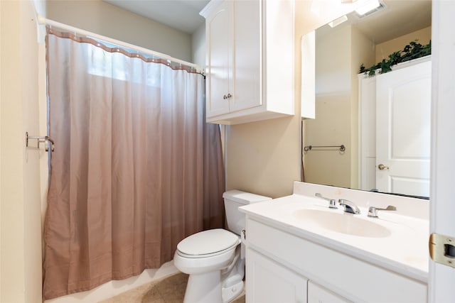 bathroom featuring tile patterned flooring, curtained shower, vanity, and toilet