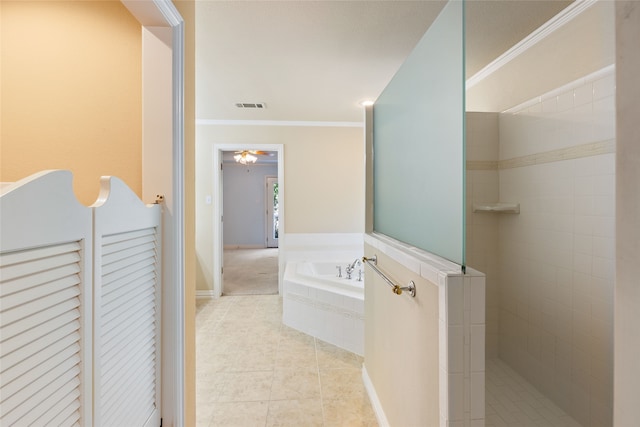 hallway with crown molding and light tile patterned floors