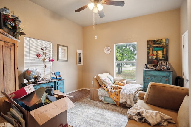 carpeted office with ceiling fan