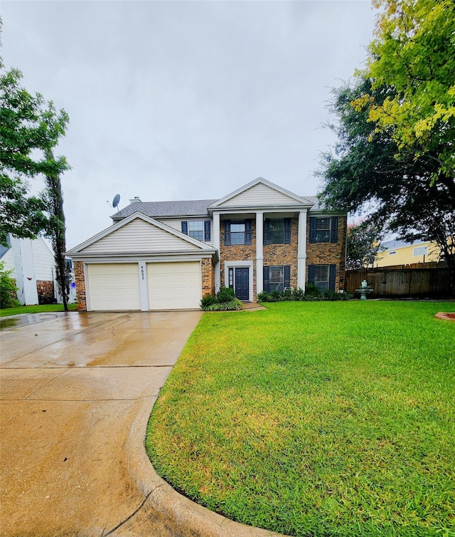 view of front of home with a garage and a front yard