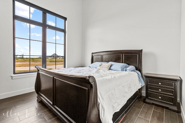 bedroom featuring dark wood-type flooring