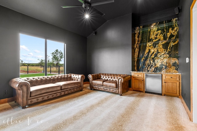 living room featuring bar, lofted ceiling, and ceiling fan