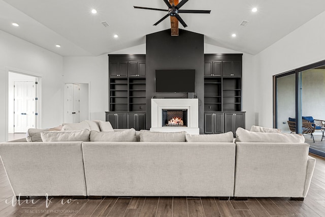 living room featuring ceiling fan, high vaulted ceiling, and dark hardwood / wood-style floors