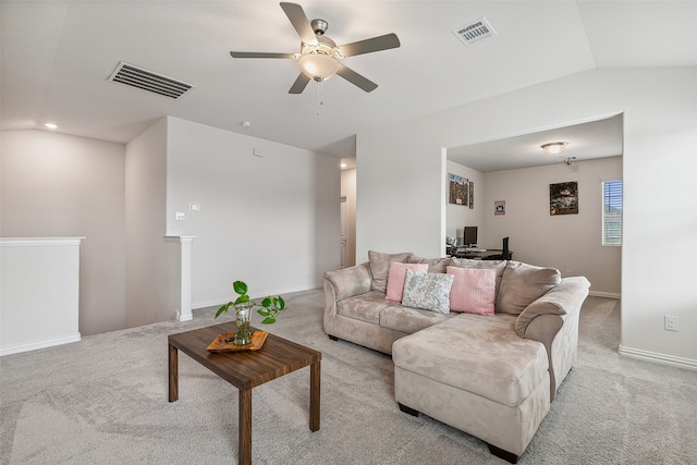 living room with light colored carpet, ceiling fan, and lofted ceiling