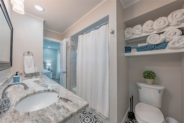 bathroom featuring crown molding, vanity, toilet, and walk in shower