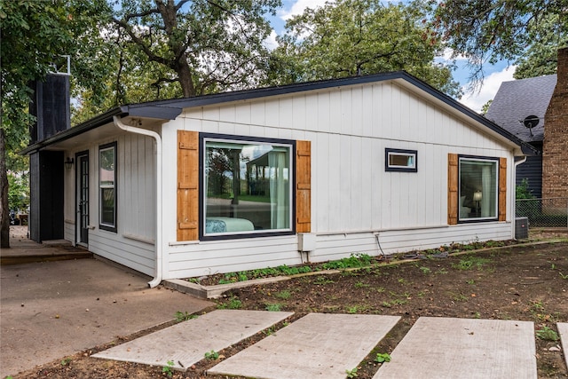 view of side of property with a patio area