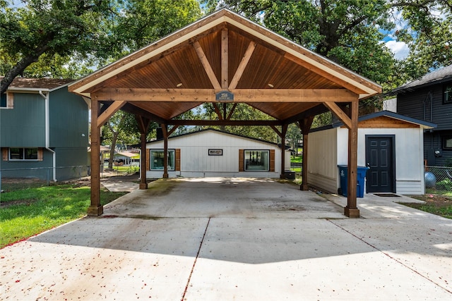 2516 Wildwood Way, Tool, TX 75143 - view of parking / parking lot featuring a detached carport, driveway, fence, and a storage unit