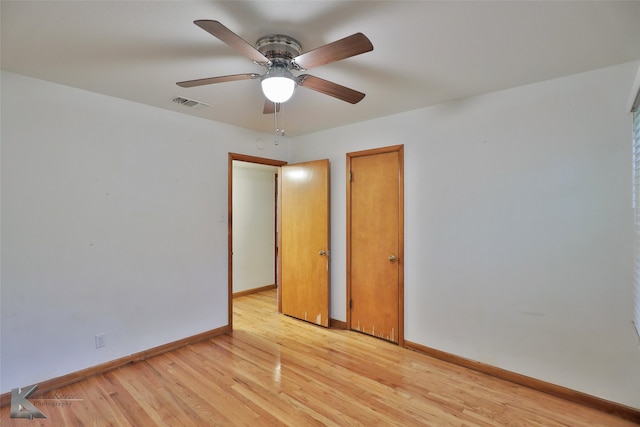 spare room with ceiling fan and light hardwood / wood-style flooring