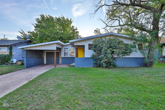 ranch-style home with a carport and a front yard