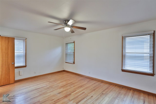 spare room with light hardwood / wood-style flooring and ceiling fan