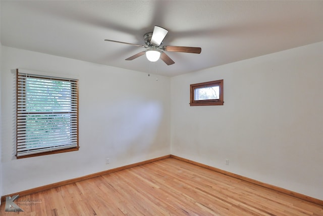 unfurnished room with wood-type flooring, ceiling fan, and plenty of natural light