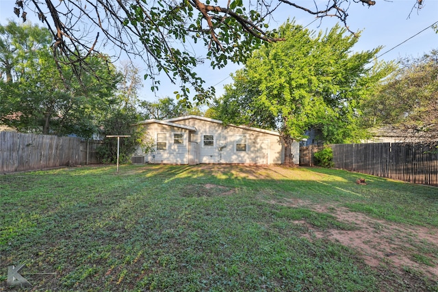 view of yard with central AC