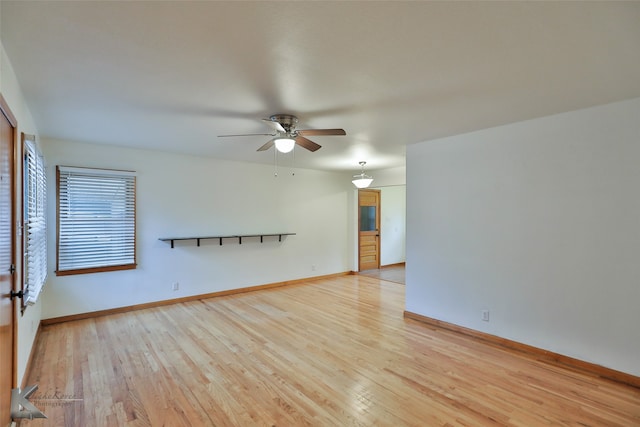 spare room featuring light hardwood / wood-style floors and ceiling fan