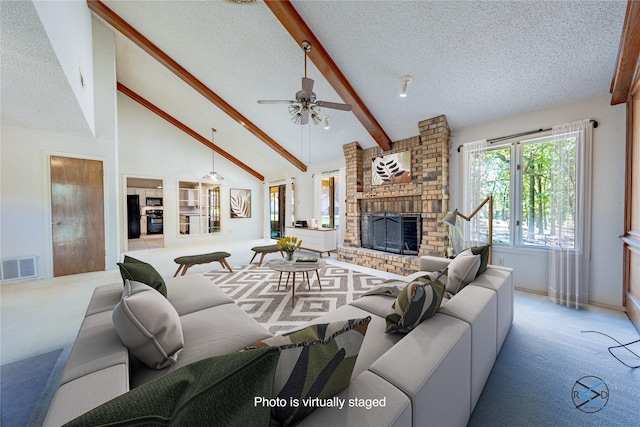 172 Colonial Dr, Mabank, TX 75156 - carpeted living room with a textured ceiling, a ceiling fan, visible vents, a brick fireplace, and beamed ceiling