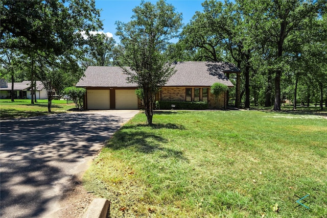 172 Colonial Dr, Mabank, TX 75156 - view of front of house with a front yard, driveway, and a garage