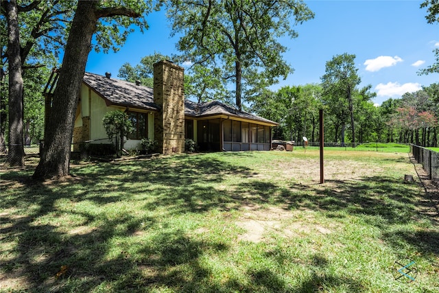 view of yard with a sunroom