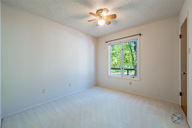 172 Colonial Dr, Mabank, TX 75156 - empty room with a textured ceiling, baseboards, a ceiling fan, and carpet