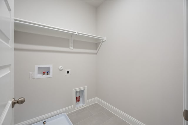 laundry area featuring washer hookup, light tile patterned floors, gas dryer hookup, and electric dryer hookup