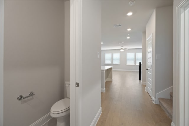 bathroom featuring toilet and hardwood / wood-style floors