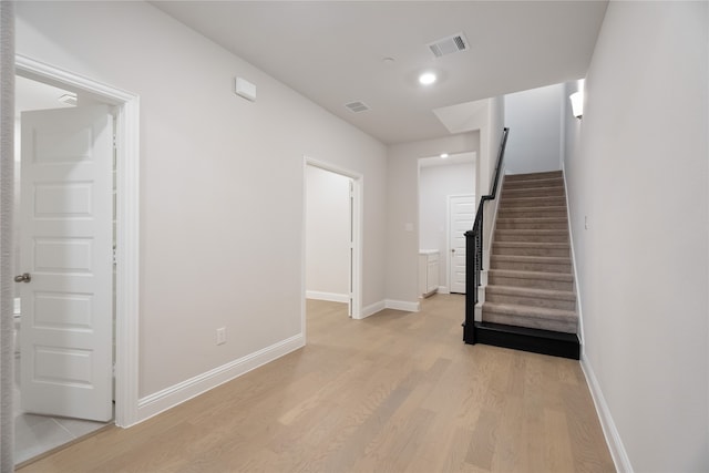 staircase featuring hardwood / wood-style flooring