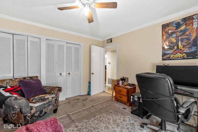 carpeted home office with crown molding and ceiling fan