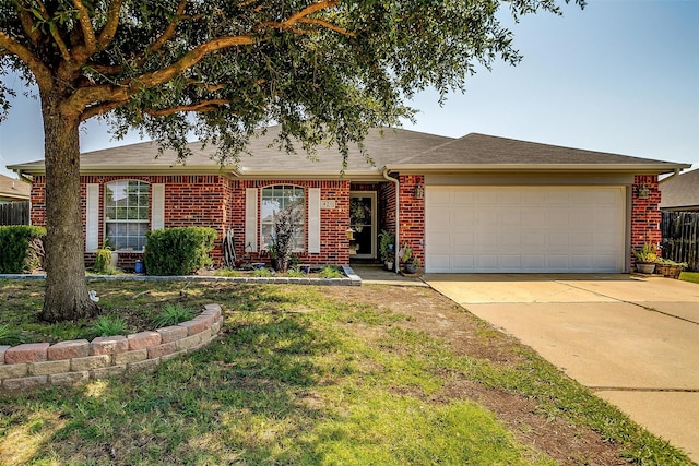 ranch-style home featuring a garage and a front yard