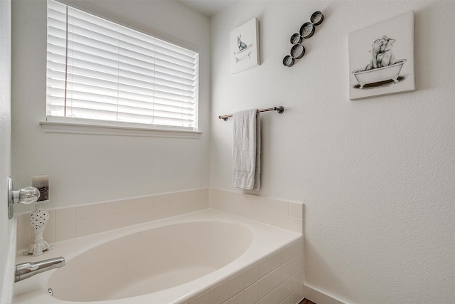 bathroom featuring tiled bath