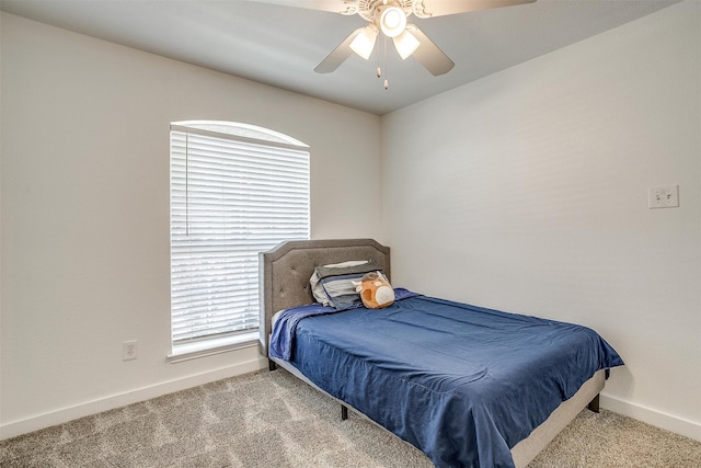 bedroom featuring ceiling fan and carpet floors