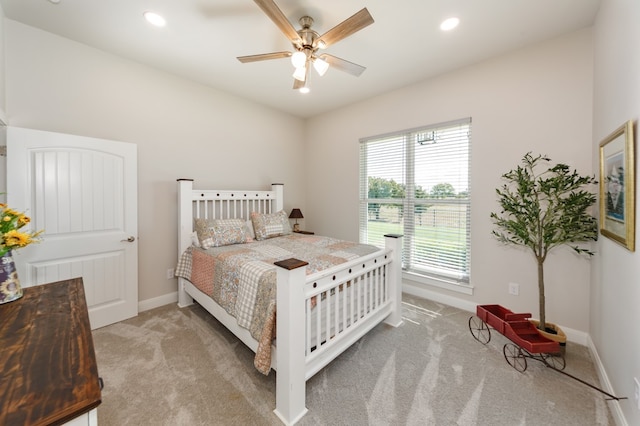 carpeted bedroom featuring ceiling fan