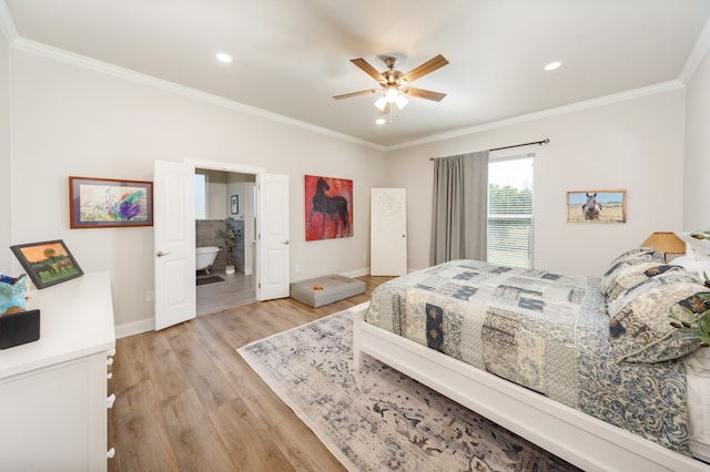 bedroom featuring light hardwood / wood-style floors, ceiling fan, ensuite bathroom, and ornamental molding