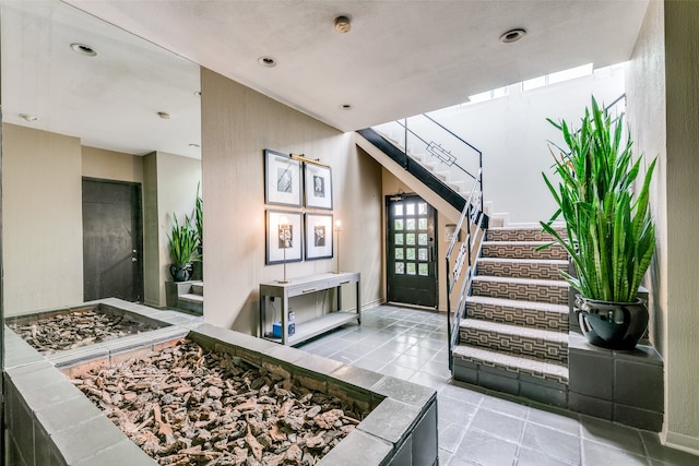 foyer entrance featuring tile patterned flooring