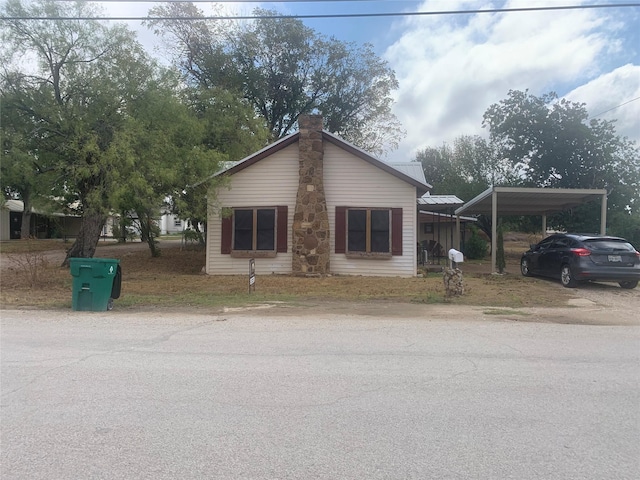 view of front of home with a carport