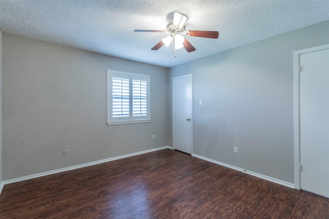 spare room featuring ceiling fan, a textured ceiling, and dark hardwood / wood-style flooring