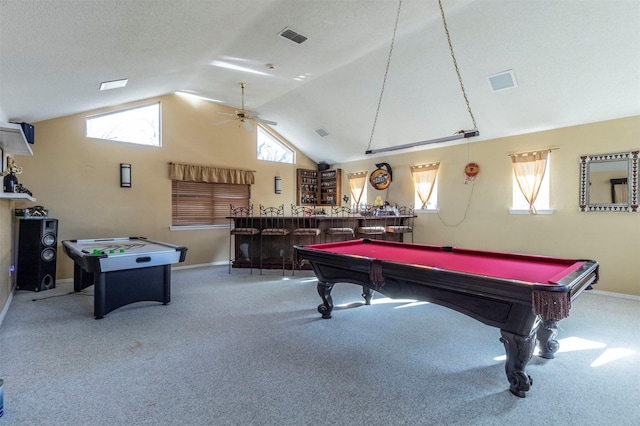 recreation room featuring pool table, a textured ceiling, indoor bar, carpet floors, and ceiling fan