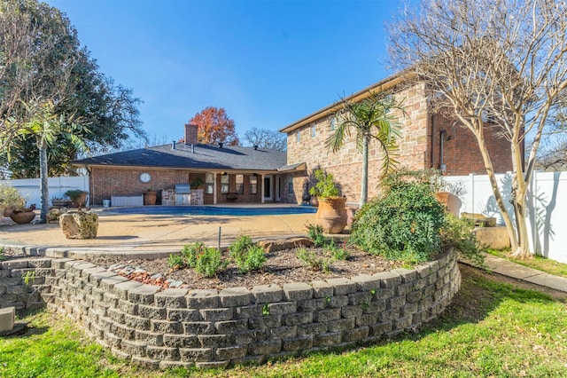 back of house featuring a patio