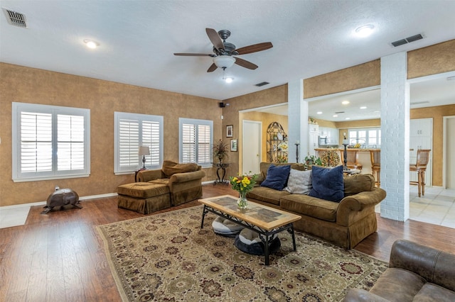 living room with hardwood / wood-style flooring and a wealth of natural light