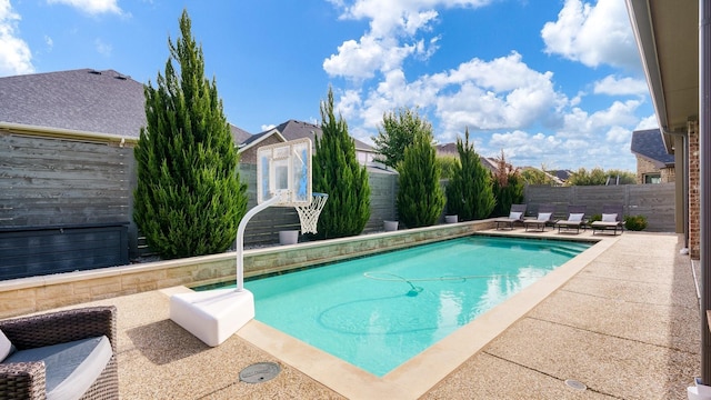 view of swimming pool with a patio