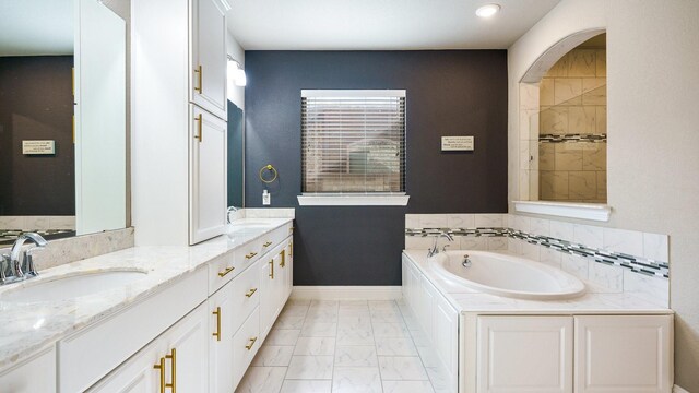 bathroom featuring a tub and vanity