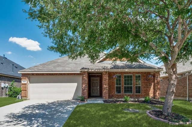 1405 Hawk Valley Dr, Little Elm, TX 75068 - view of front facade featuring a garage, driveway, a front yard, and brick siding