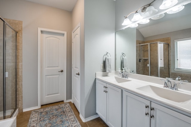 bathroom featuring vanity, tile patterned floors, and walk in shower